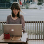 Woman Using AI Market Research Tool On Her Laptop