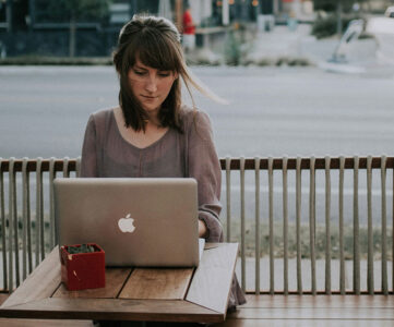 Woman Using AI Market Research Tool On Her Laptop