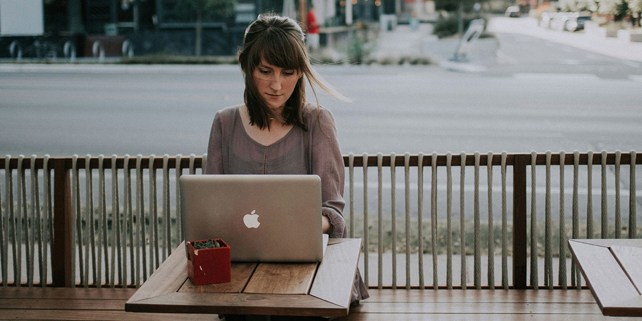 Woman Using AI Market Research Tool On Her Laptop